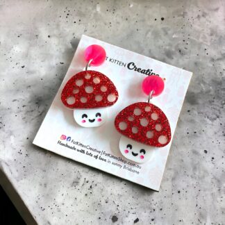 Mushroom Dangle earring. Red glitter topper, white acrylic combined with a pink marble top. How cute.